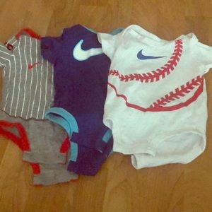 Set of three Nike baby onesies